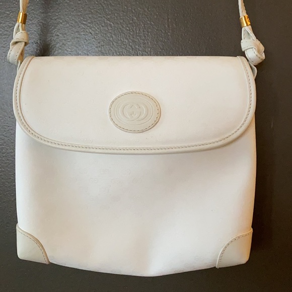 Gucci Handbags - Gucci white crossbody bag with gold accents